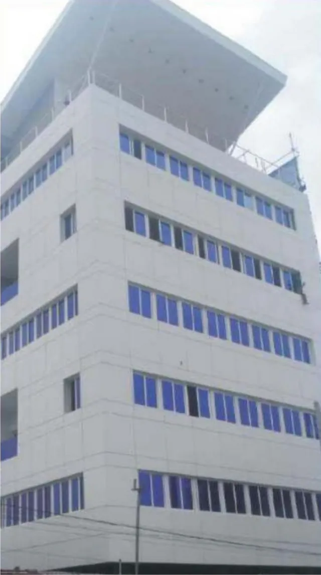 Multi-storey commercial building at 40 Montgomery Road, Yaba, Lagos, with white cladding and blue glazing