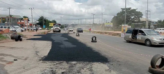 Road construction in Anambra State: laying asphalt surfacing