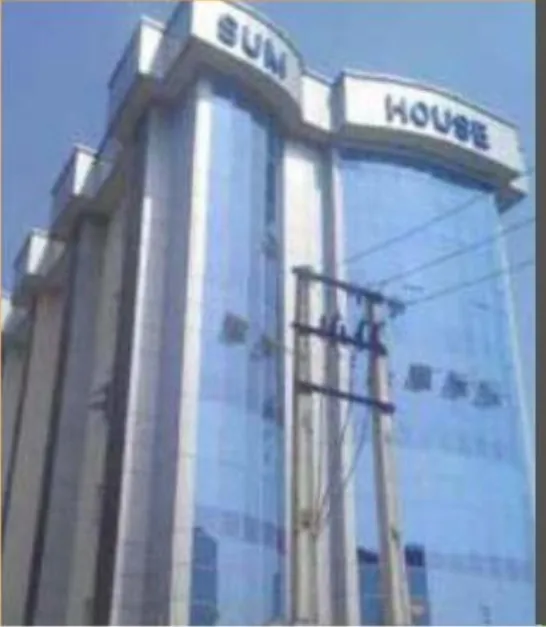 Sum House, Yaba: glazed tower rising from the street